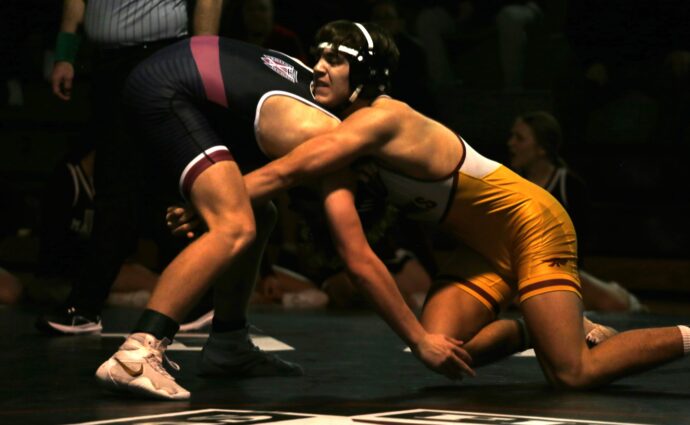 Dowling wrestlers overcome 21-point deficit to tie Hawks, then win on criteria